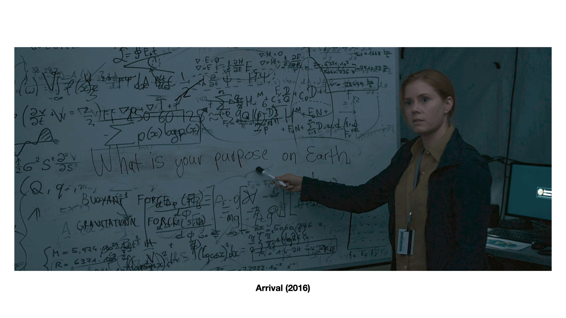 Slide: Dr. Louise Banks at the whiteboard in Arrival (2016), pointing at 'What is your purpose on Earth'